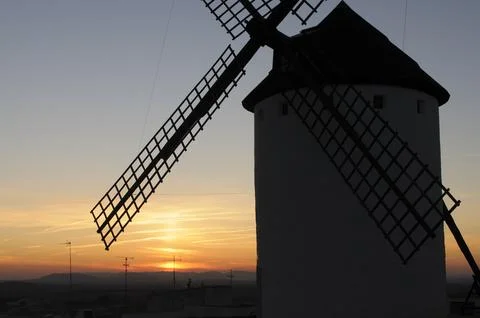 Windmill Silhouette at Sunset Stock Photos