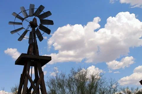 The windmill, the sky and the clouds Stock Photos