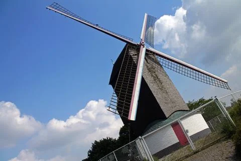 The windmill, the sky and the clouds Stock Photos