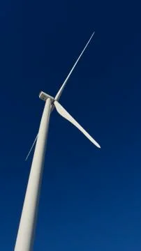 Windmill on sky background Stock Photos