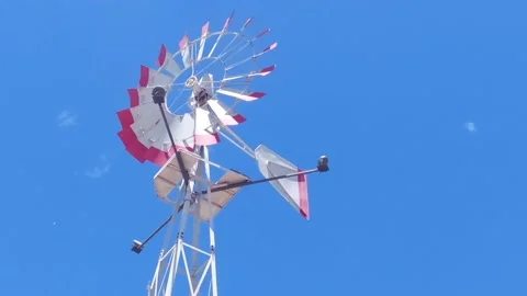 Windmill slowing to a stop Stock Footage 173582305