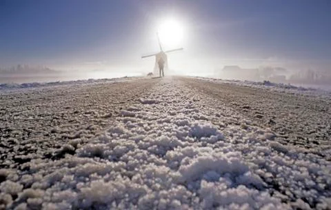 Windmill in snow Фото