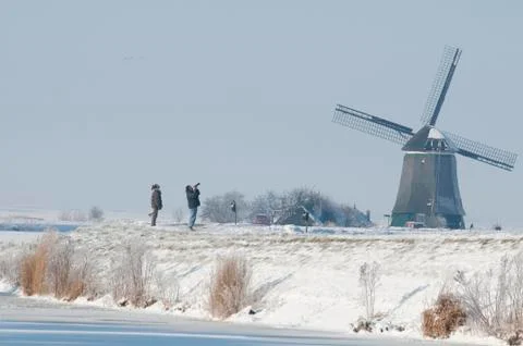 Windmill in snow Photos