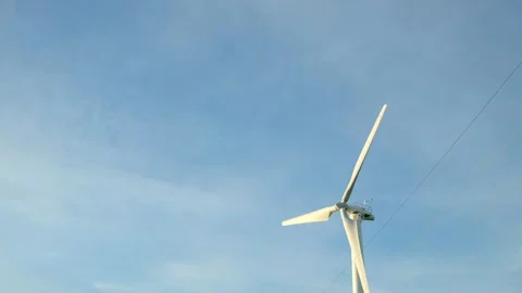Windmill Spinning Against Blue Sky with Copy Space Vídeos de archivo 337623570