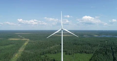 Windmill With Spinning Propellers Stand Amidst a Forest Stock Footage 113295036