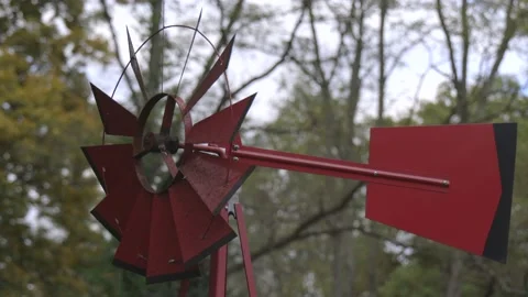 Windmill spinning showing wind direction with fall foliage in the Stock Footage 172348581