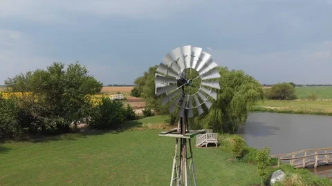 Windmill spinning on a summer day Stock Footage 113969116