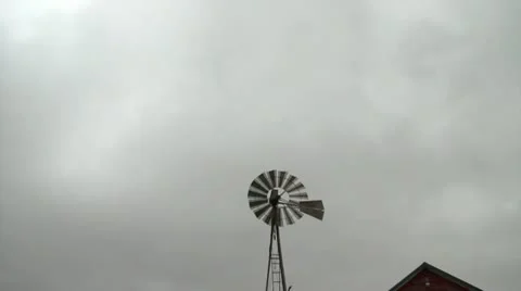 Windmill Spins in Gray Sky Stock Footage 12616508