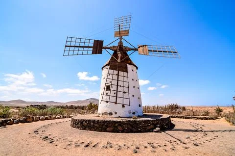 A windmill is standing in a desert Fotos Stock