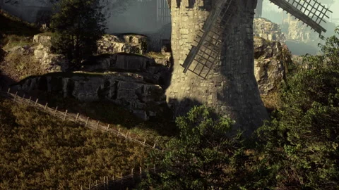 Windmill Stands Tall Among the Lush Green Hills in the Early Morning Light Stock Footage 344951084