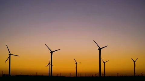 A windmill with a sunset in the background Stock Footage 137125676