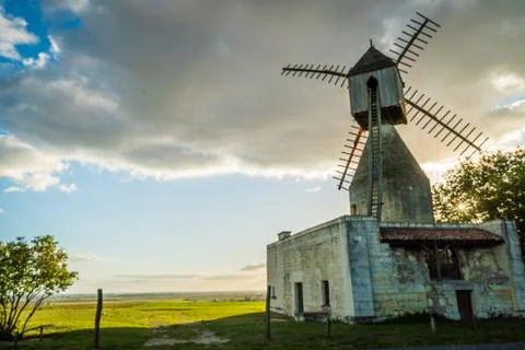 Windmill at sunset Stock Photos