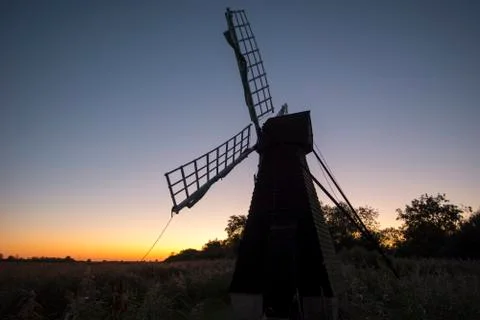 Windmill at sunset Stock Photos