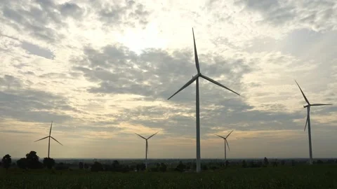 A windmill on top of a grass covered field 库存影片 156843614