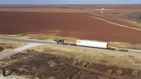 Windmill Tower Section on a Heavy Hauler Truck, Brazos County, Texas, USA Stock Footage 145949204