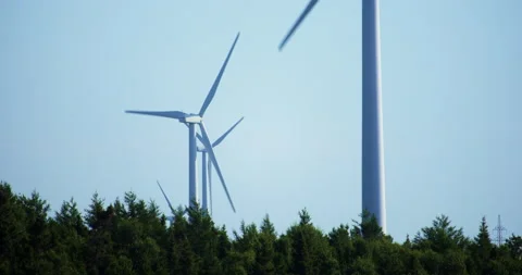 Windmill turbine with top of trees / Matane / Close up Stockbeeldmateriaal 130918281