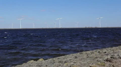 Windmill turbines on shore Stock Footage 22371430