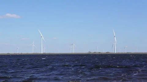 Windmill turbines on shore Stock Footage 22372357