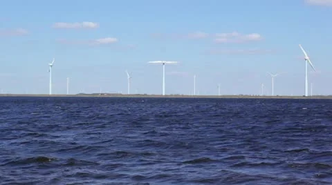 Windmill turbines on shore Stock Footage 22372611