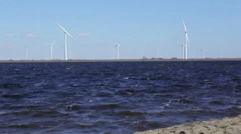 Windmill turbines on shore Stock Footage 22372650