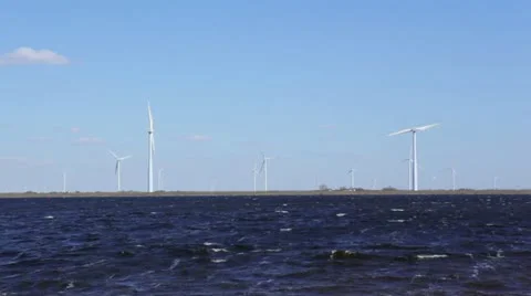 Windmill turbines on shore time lapse Stock Footage 22372465