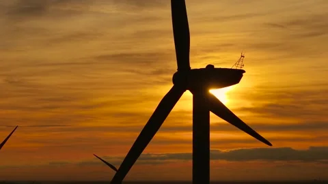 Windmill turning in glowing sunset breeze. Creating energy from warm wind flow. Stock Footage 332219795