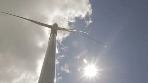 Windmill turning from low angle with sun Stock Footage 46997287