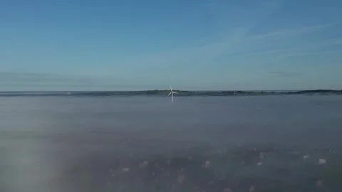 Windmill Turning In The Wind with Mist at Base Stock Footage 248623017