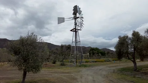 Windmill under a stormy sky in the Karoo desert, Barrydale South Africa Stock Footage 226548807