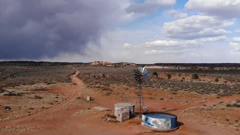Windmill water pump under dramatic sky. Arizona Good And Bad Weather. Stock Footage 241687884