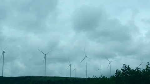 Windmill wind energy farm work well on cloudy sky sustainable alternative g.. Stock Footage 258533810
