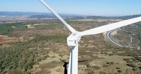 Windmill wind turbines on a windy day electricity generating turbines Stock Footage 124220516