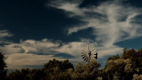 Windmill windpump artistic clouds and trees Stock Footage 112531104
