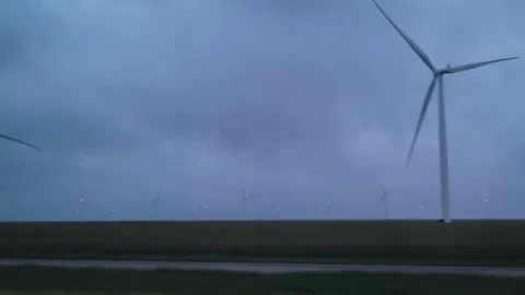 Windmills across the plains Stock Footage 276017509