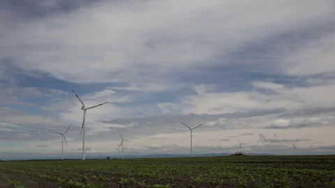 Windmills against time lapse clouds Stock Footage 240821142