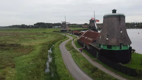 Windmills and Greenery at Zaanse Schans Reflecting Dutch Heritage Stock Footage 304826880