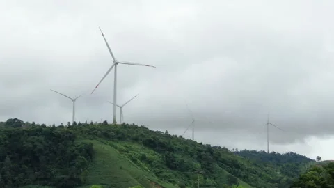 Windmills are spinning between the clouds. 20.04.2024 Baku, Azerbaijan Stock Footage 280935279