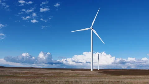 Windmills on a background of blue sky with clouds Stock Footage 146175803
