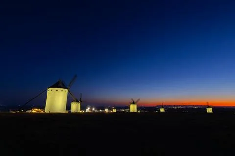 Windmills of Campo de Criptana at night with sunset sky Stock Photos
