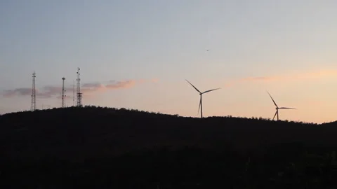 Windmills &amp; Cell Towers at Sundown Stockbeeldmateriaal 130908700