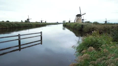 Windmills by the channel in Netherlands 스톡 동영상 120134624
