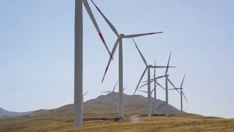 Windmills converting wind energy into electricity Stock Footage 79986822