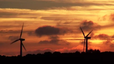 Windmills in de orange sunset Stock Footage 82772402