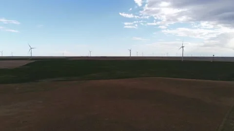 Windmills in Eastern Colorado with highway 動画素材 250352201