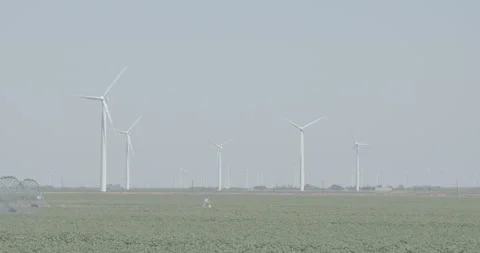 Windmills in front of Field Stock Footage 134363922
