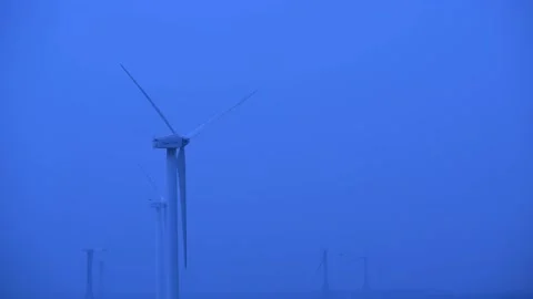 Windmills functioning on a cloudy day in India. 動画素材 223211718
