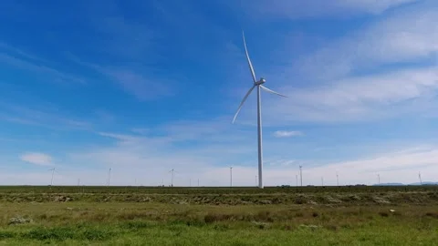Windmills generating electrical energy. Blue sky with clouds. Horizontal sc.. Stock Footage 291541279