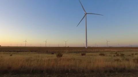 Windmills generating electrical energy. Horizontal scanning from a mobile 4.. Stock Footage 325746698