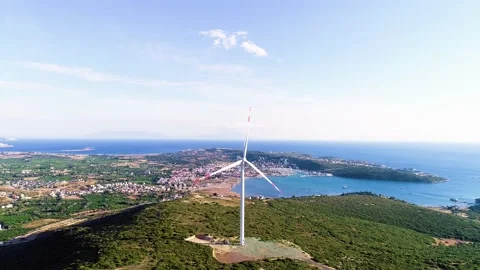 Windmills generating electricity in the forest area accompanied by a sea view 库存影片 236446679