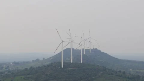 Windmills generating Power on the Hill range in Hassan, Karnataka, India. Stock Footage 164697745